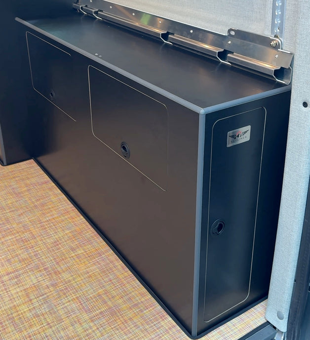 Compact 20 gallon water cabinet installed over wheel well in Sprinter van vanabove