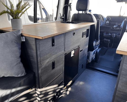 Compact kitchen unit installed in a van